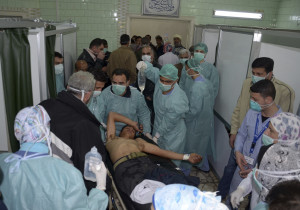 A man, wounded in what the government said was a chemical weapons attack, is treated at a hospital in the Syrian city of Aleppo
